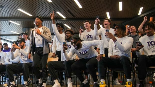 TCU basketball celebrates tournament berth.